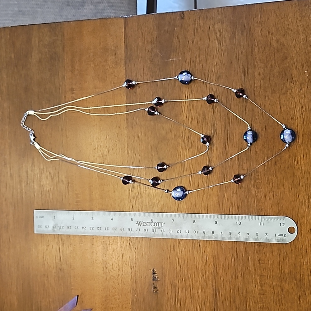 Three-strand necklace with purple glass beads